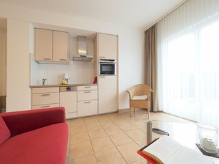 Strandpalais Ferienwohnung 31 -  Wohnzimmer mit Küche