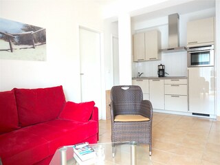 Strandpalais Ferienwohnung 37 -  Wohnzimmer mit Küche