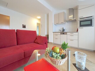 Strandpalais Ferienwohnung 38 -  Wohnzimmer mit Küche