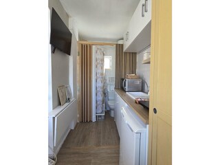 Kitchenette and studio entrance