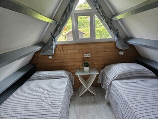 Schlafzimmer unter dem Dach