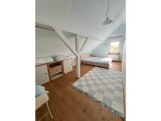 Schlafzimmer 1 mit Doppelbett im Obergeschoss