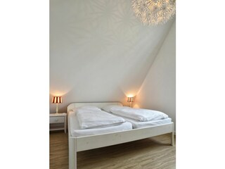 Das dritte Schlafzimmer befindet sich im DG.