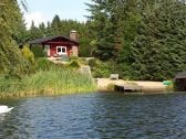 Ferienhaus mit eigenem Strand am Badesee