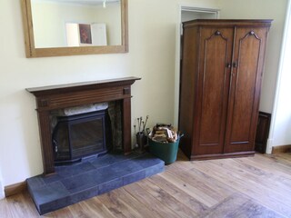 Livingroom by day. Antik furniture and solid oak floor.