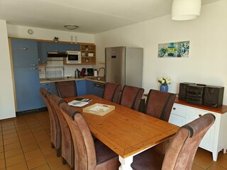 View of the dining table and kitchen