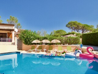 The pool has plenty of poolside beds