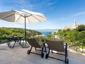 Terrace with view of the sea and the old town