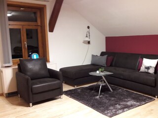 Wohnzimmer mit Schlafsofa