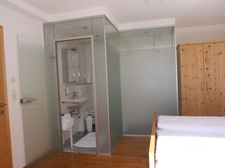 the 4-bed bedroom with shower and WC