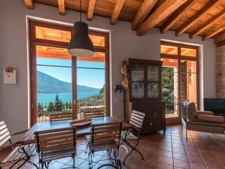 Living room with kitchen,view on Lake Garda.