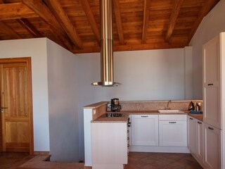 Living room with kitchen, overlooking Lake Garda.