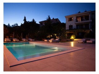 terrace with pool at night