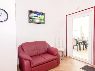 Fernsehecke und Balkonausgang