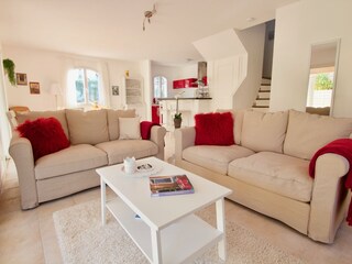 Bright lounge area and stairs to floor