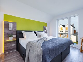 Schlafzimmer 2 ein Kinderhochstuhl und Babybett gehört zur Grundausstattung