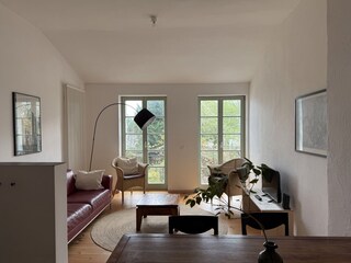 Living area with balcony access and view of the Havel