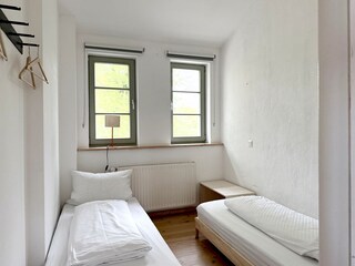 Small bedroom with stackable single beds