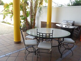 Andalusian terrace with dining area and...