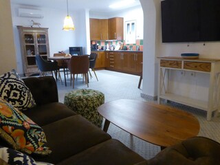 Open-plan living concept: living room with TV ...