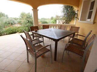 large covered terrace, table and chairs for 8 persons