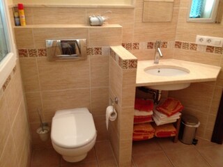 bath 1 en suite: shower cabin with seat hair dryer