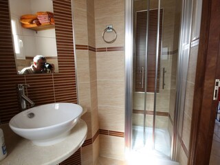 bath 2, large shower cabin with seat, hairdryer, towels