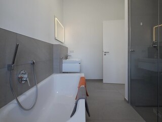 Bathroom no. 1 with bathtub, walk-in shower, toilet