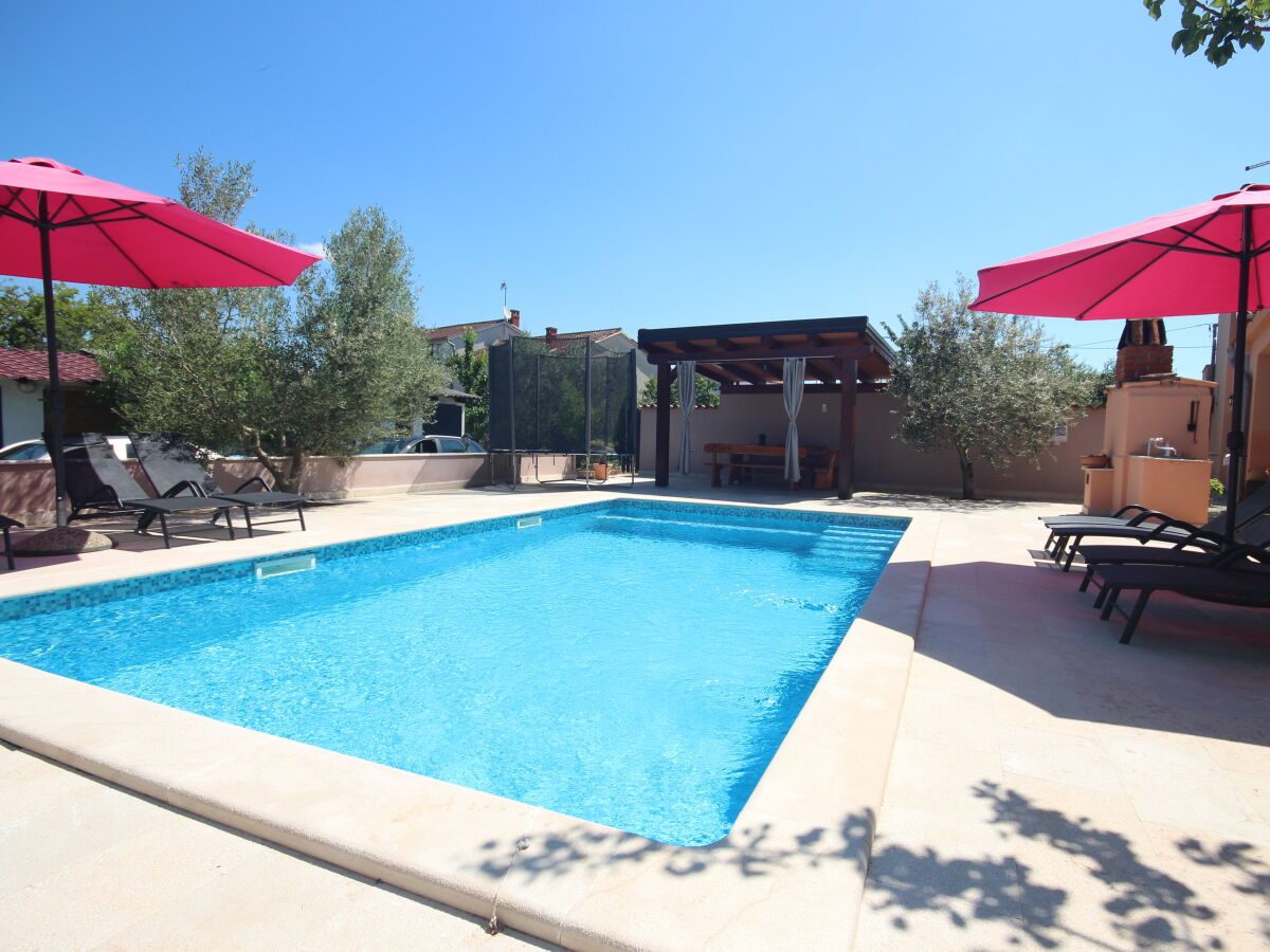 Pool deck with trampoline for kids