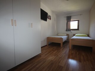 bedroom on groundfloor with TV  in house nr. 2