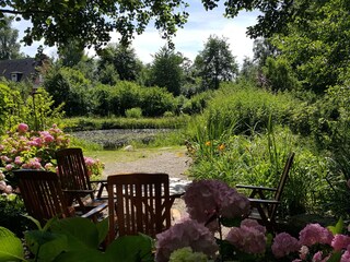 Seat in the garden pond
