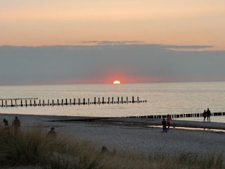 Geniessen Sie den Sonnenuntergang an der Seebrücke