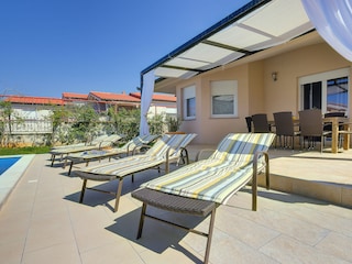 Sun loungers by the pool