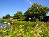 Ferienhaus Fields mit Picknicktisch am Wasser