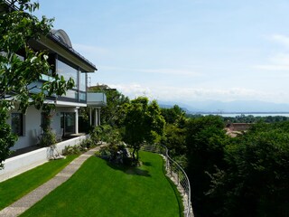 terrace and garden with lake and mountain view