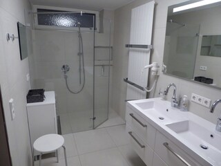 bathroom with shower and separate bath tub