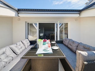 Large terrace with garden furniture, automatic awning .