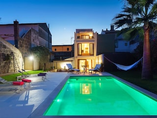 House and garden at night