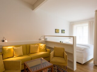 Living area with box spring bed