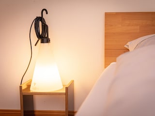 Nr. 3 Schlafzimmer 1. OG mit Schlafsofa und Poolblick