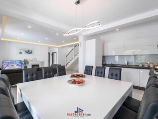 The kitchen with a large dining table