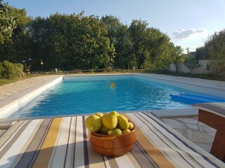 Outdoor pool with sun loungers