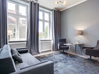 Room with double bed with oriel window.