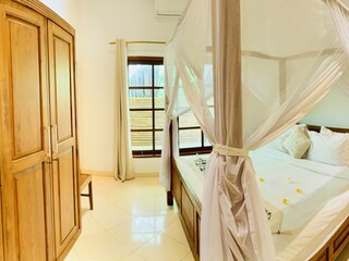 bedroom with large cupboard and safe.