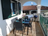 Balcony with BBQ and beautiful view on garden and pool