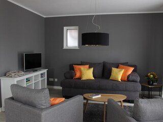 Wohnbereich mit Schlafsofa App Sonnenanbeter