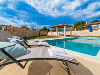 Private garden with a pool and loungers