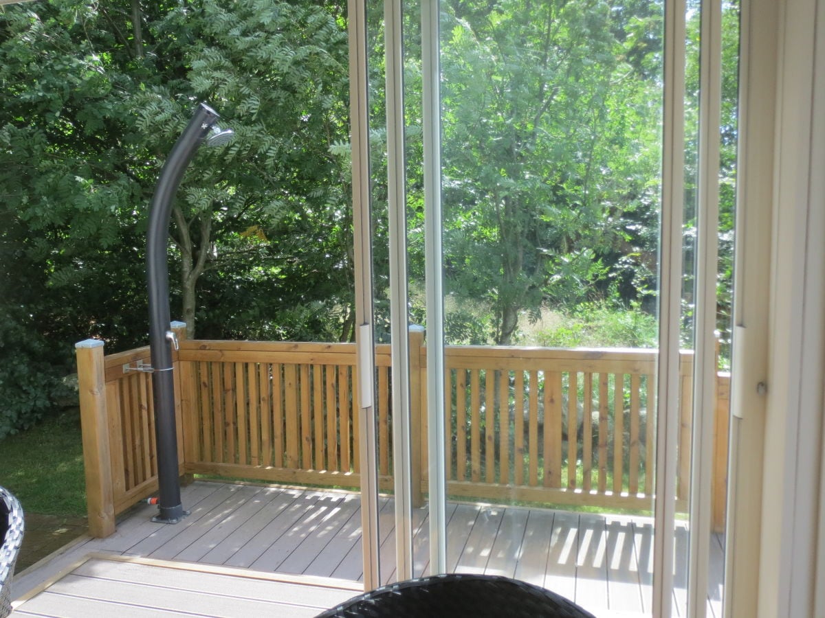 Solar-heated outdoor shower