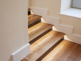 Steps from the living area into the bedroom