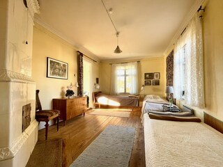 Das einladende Schlafzimmer für 3 P, mit Kachelofen